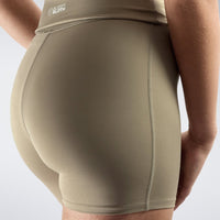 Rolled Shorts in khaki on model - Drift Collection activewear