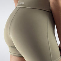 Rolled Shorts in khaki on model - Drift Collection activewear