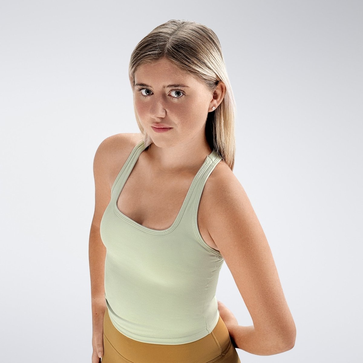 Racerback Tank Vest in ivory cream on model - Echo Collection activewear