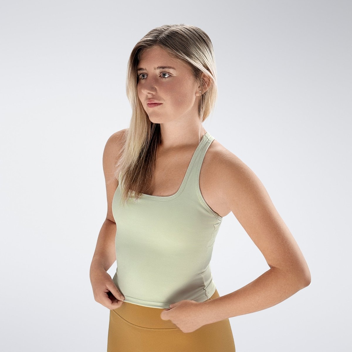 Racerback Tank Vest in ivory cream on model - Echo Collection activewear
