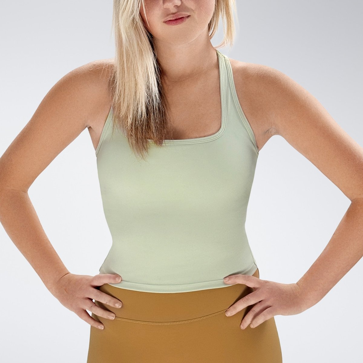 Racerback Tank Vest in ivory cream on model - Echo Collection activewear