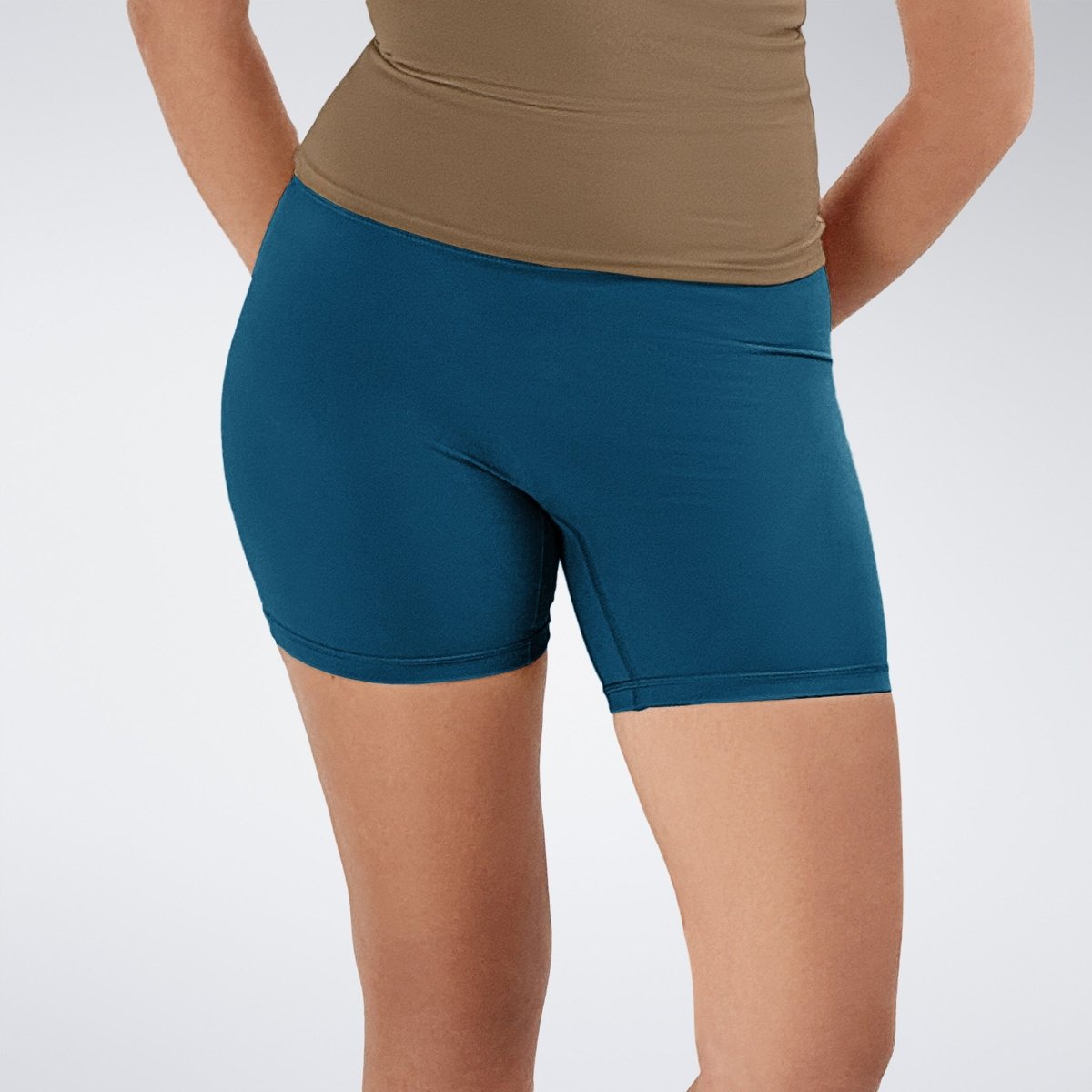 Shorts in peacock green on model - Flow State Collection activewear