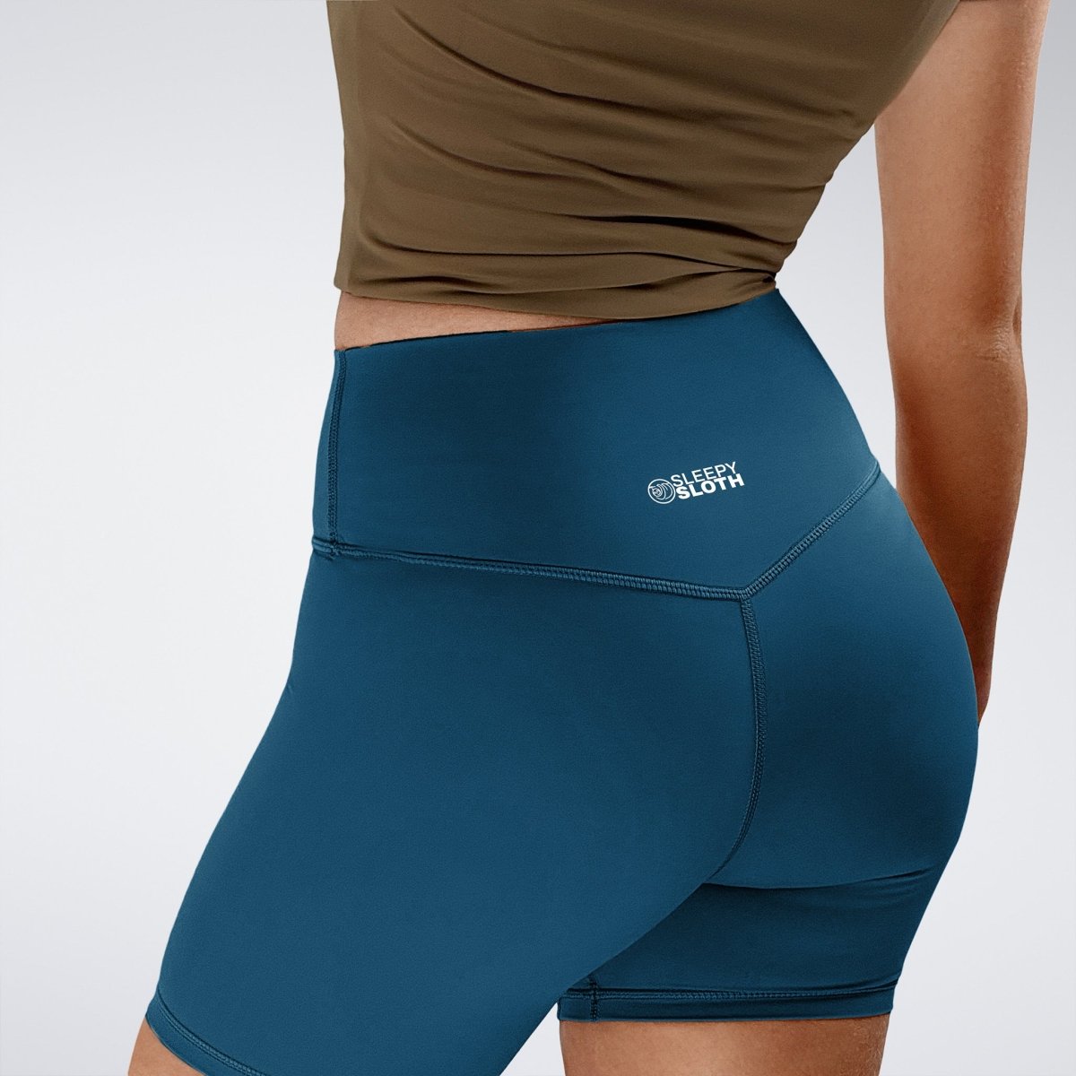 Shorts in peacock green on model - Flow State Collection activewear