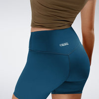 Shorts in peacock green on model - Flow State Collection activewear
