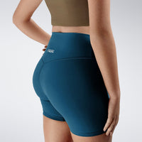 Shorts in peacock green on model - Flow State Collection activewear
