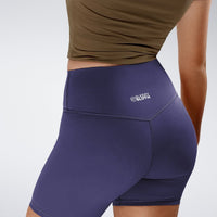 Shorts in purple on model - Flow State Collection activewear