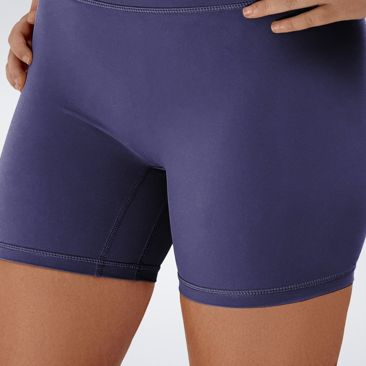 Shorts in purple on model - Flow State Collection activewear