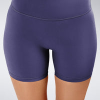 Shorts in purple on model - Flow State Collection activewear