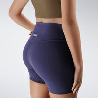 Shorts in purple on model - Flow State Collection activewear