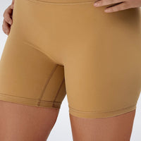 Shorts in apricot brown on model - Flow State Collection activewear