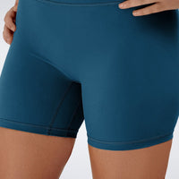 Shorts in peacock green on model - Flow State Collection activewear