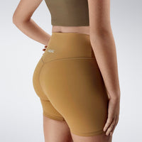Shorts in apricot brown on model - Flow State Collection activewear