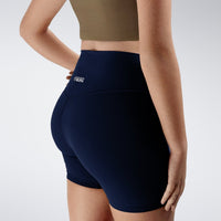 Shorts in midnight blue on model - Flow State Collection activewear