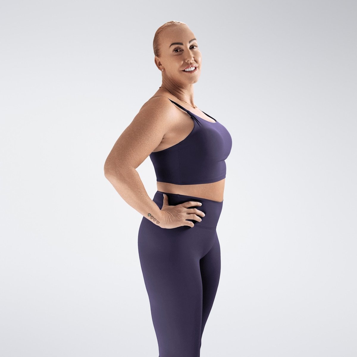 Sports Bra in purple on model - Flow State activewear