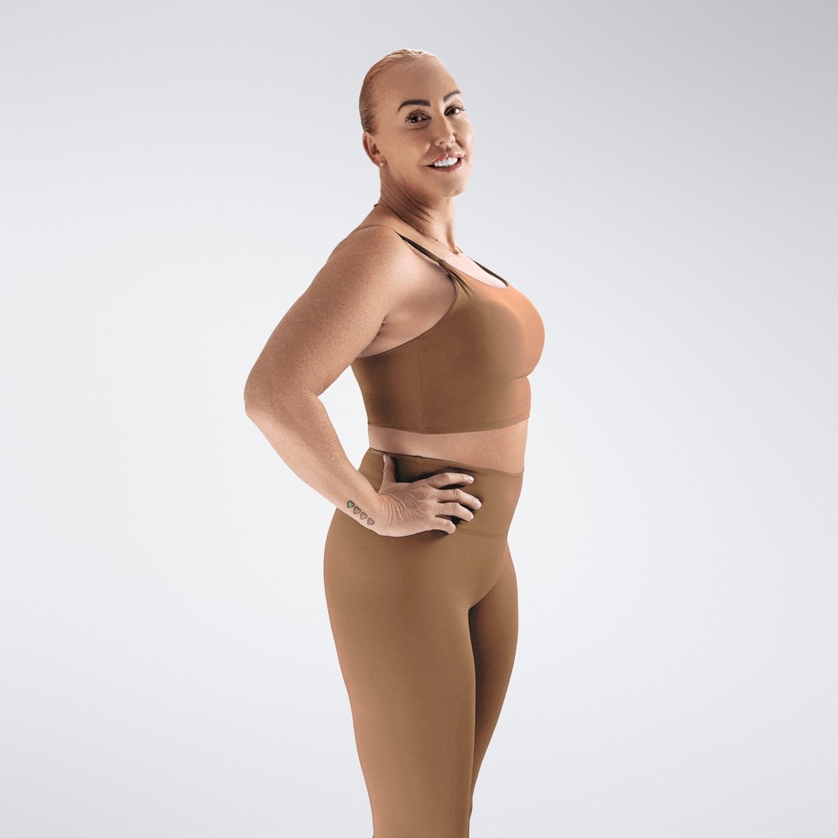 Sports Bra in apricot brown on model - Flow State activewear