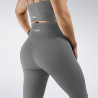 Leggings in battleship gray on model - Flow State activewear