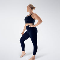 Leggings in midnight blue on model - Flow State activewear