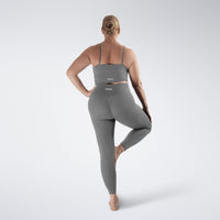 Leggings in battleship gray on model - Flow State activewear