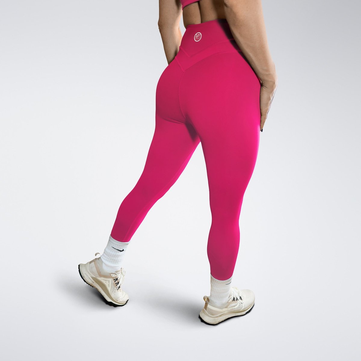 Leggings in hot pink on model - Halo Collection activewear