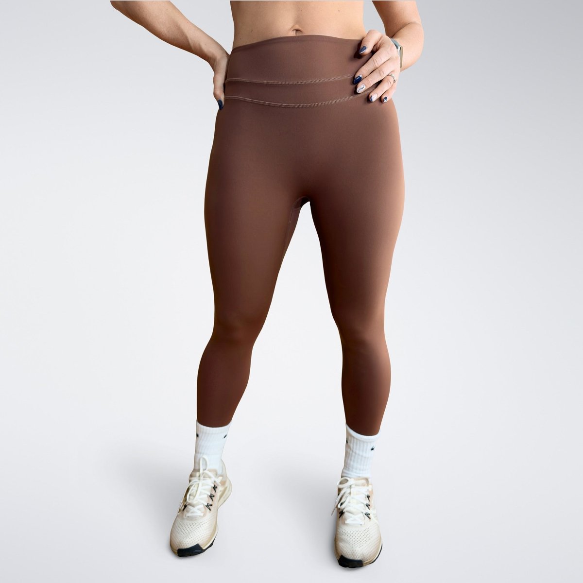 Leggings in chocolate brown on model - Halo Collection activewear