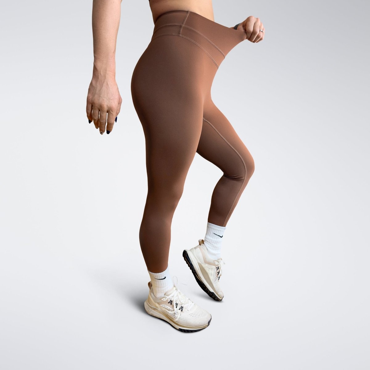 Leggings in chocolate brown on model - Halo Collection activewear