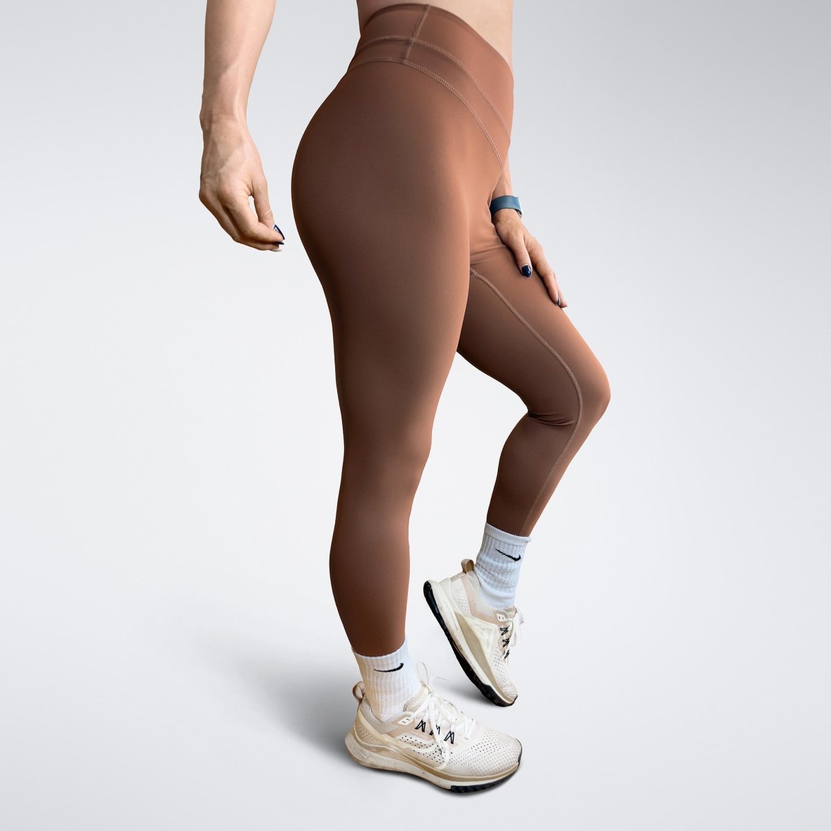 Leggings in chocolate brown on model - Halo Collection activewear