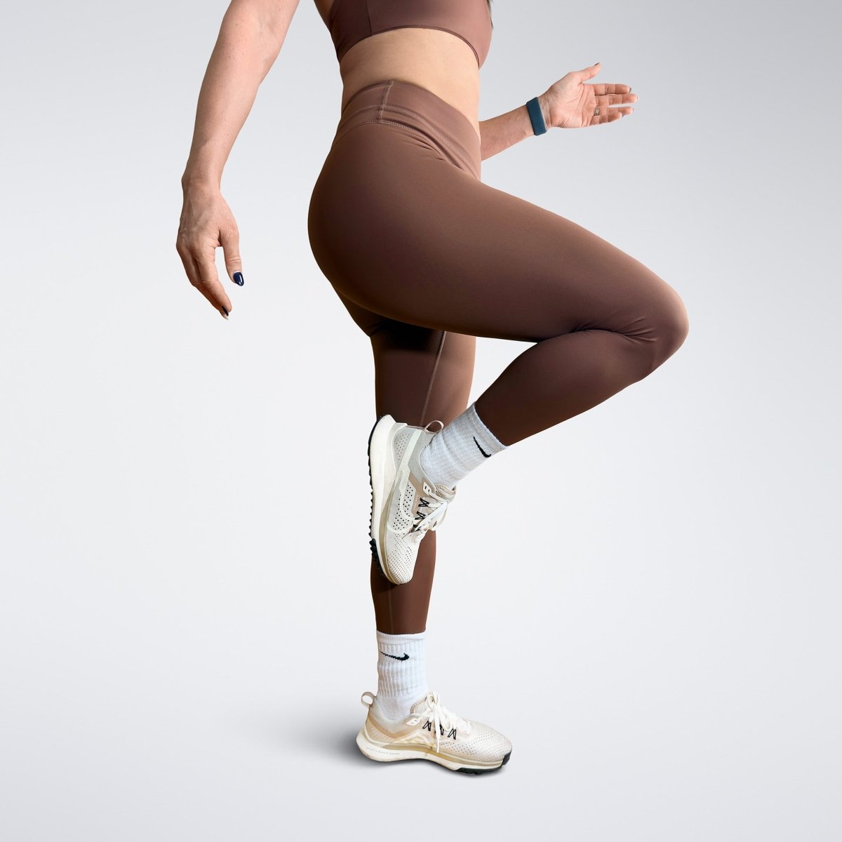 Leggings in chocolate brown on model - Halo Collection activewear