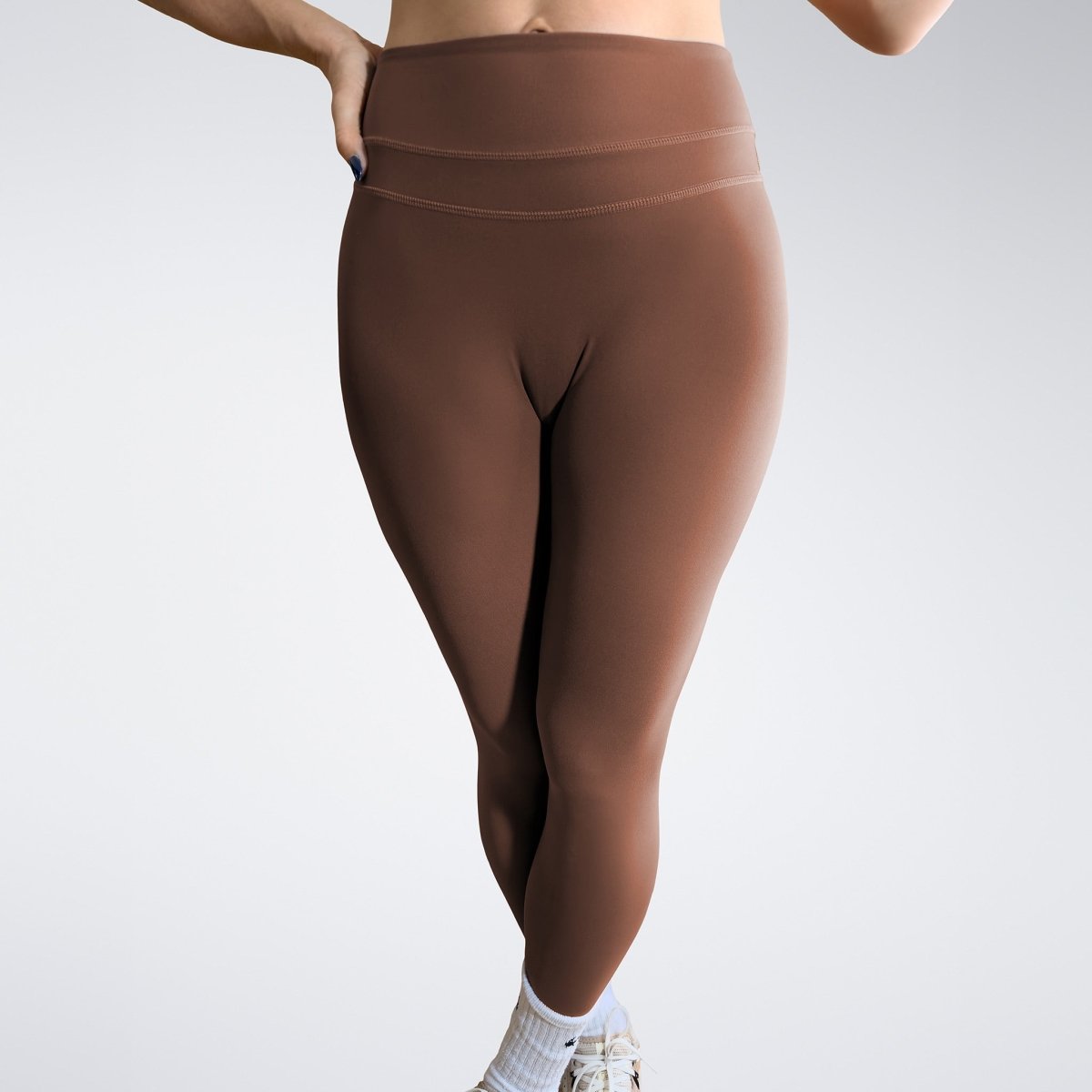 Leggings in chocolate brown on model - Halo Collection activewear