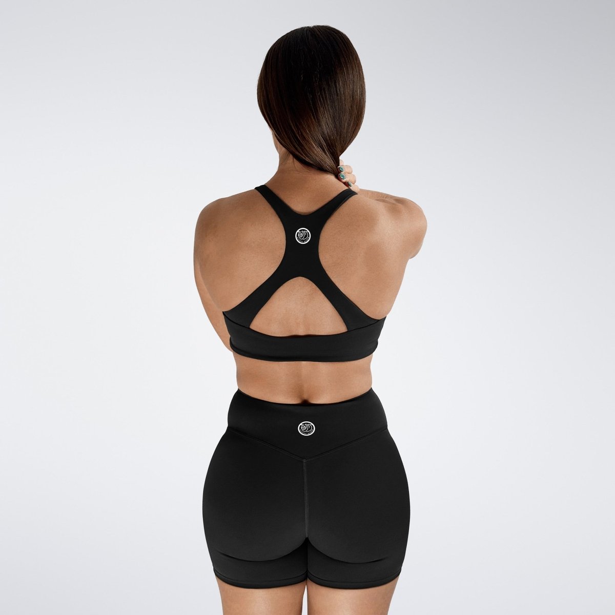 Reformer Cross Back Sports Bra in Black — product view