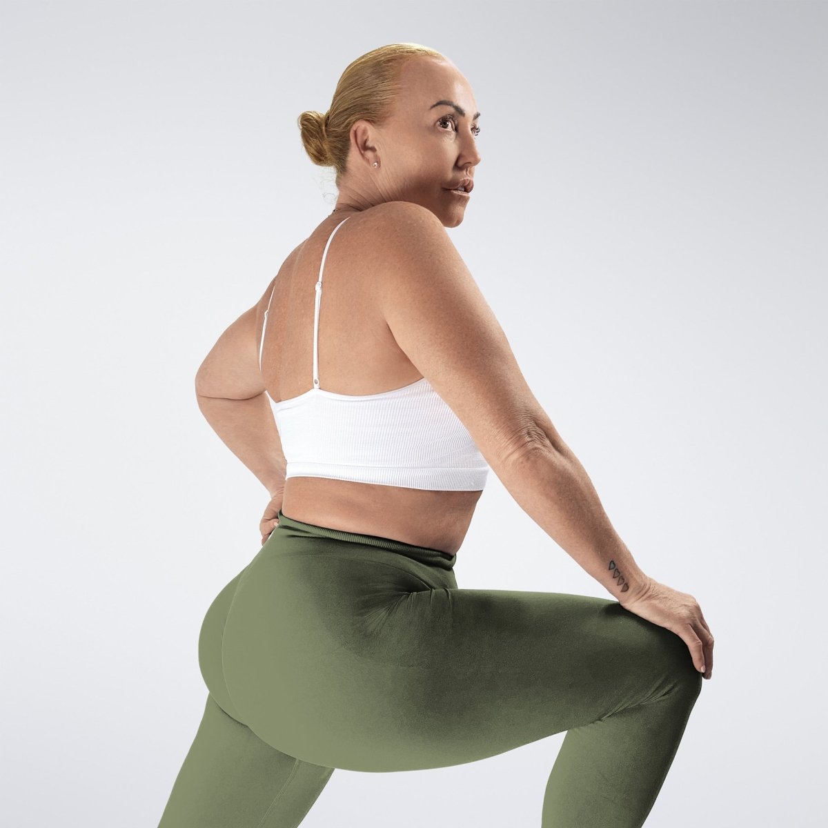 Leggings in soft sage on model - Evolve Collection activewear