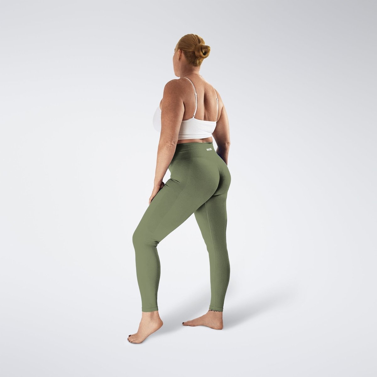 Leggings in soft sage on model - Evolve Collection activewear