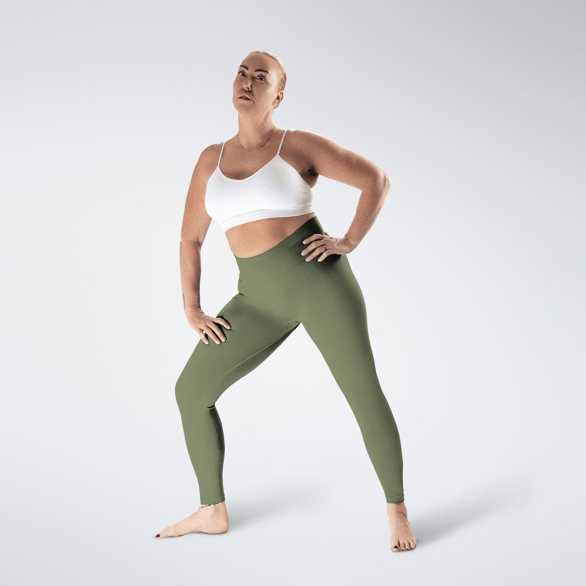 Leggings in soft sage on model - Evolve Collection activewear
