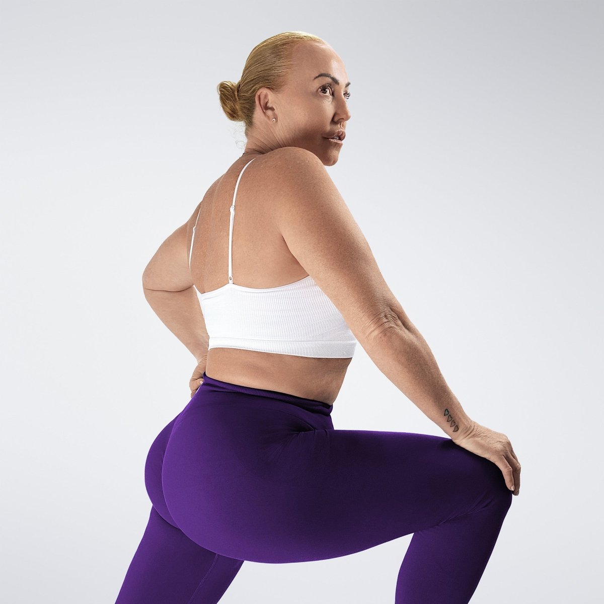 Leggings in purple on model - Evolve Collection activewear