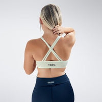 Cross Back Yoga Bra in white on model - Rise Collection activewear