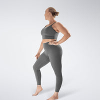 Leggings in battleship gray on model - Flow State activewear