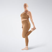 Leggings in apricot brown on model - Flow State activewear