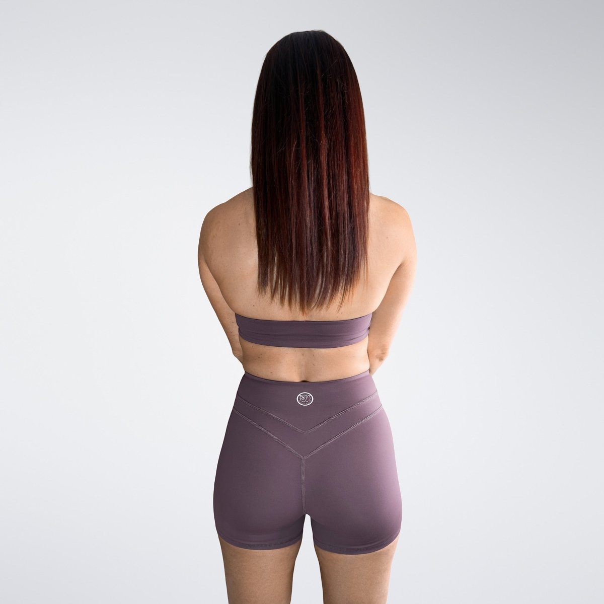 Shorts in plum on model - Halo Collection activewear
