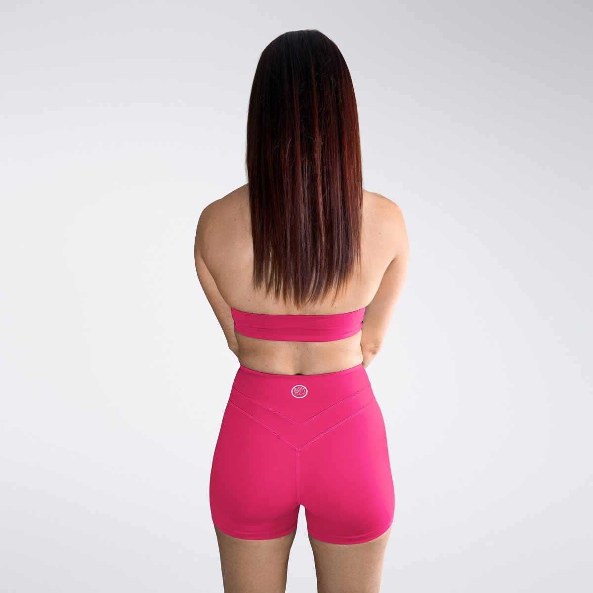 Shorts in hot pink on model - Halo Collection activewear