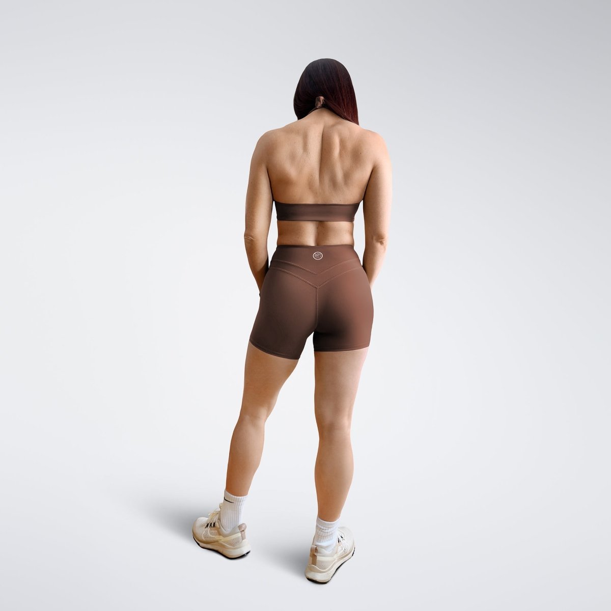 Shorts in chocolate brown on model - Halo Collection activewear