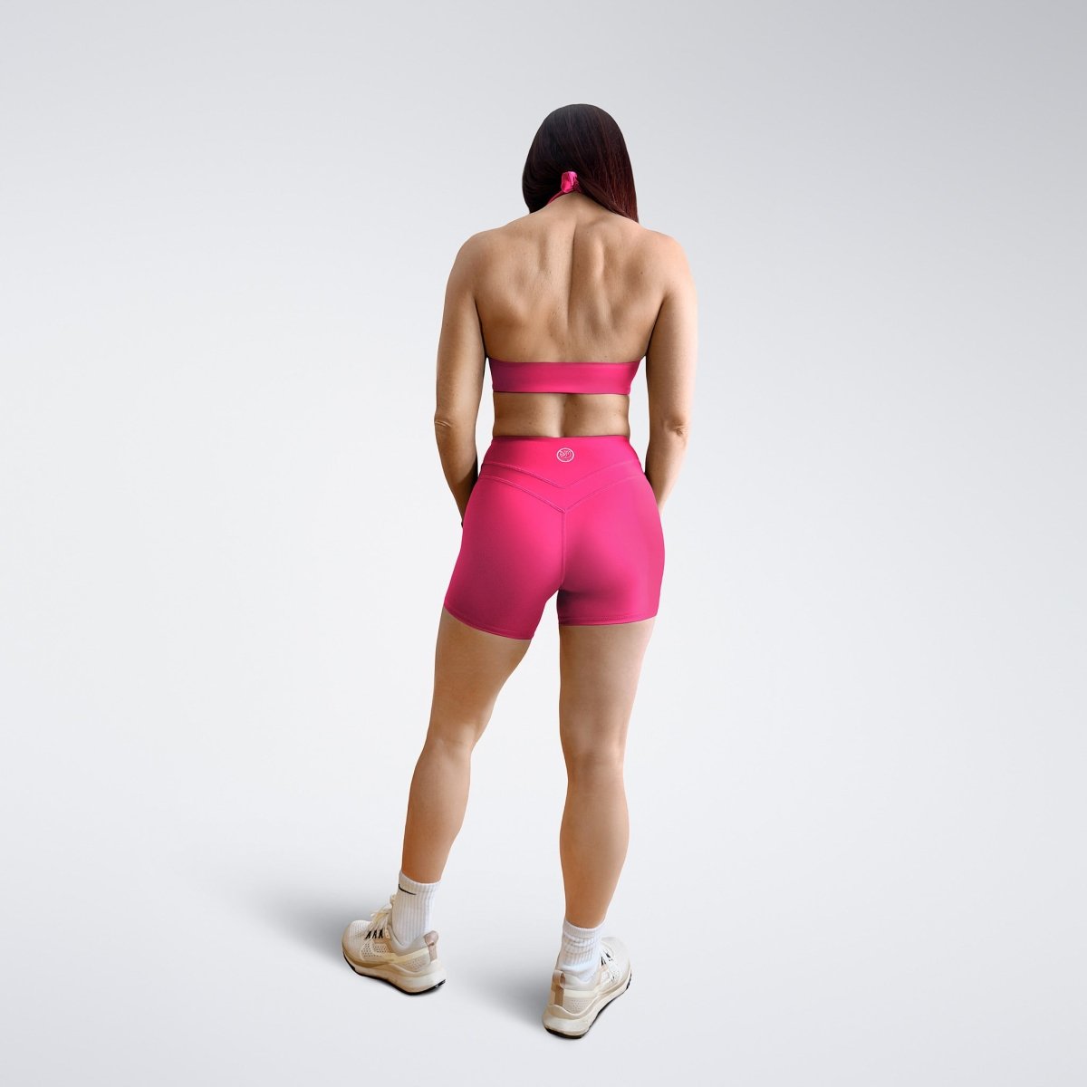 Shorts in hot pink on model - Halo Collection activewear