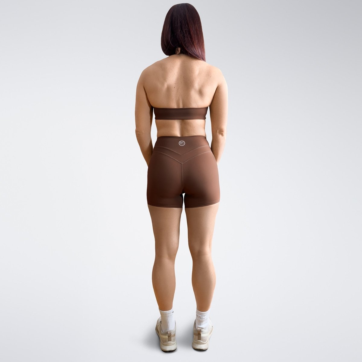 Shorts in chocolate brown on model - Halo Collection activewear