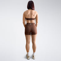 Shorts in chocolate brown on model - Halo Collection activewear