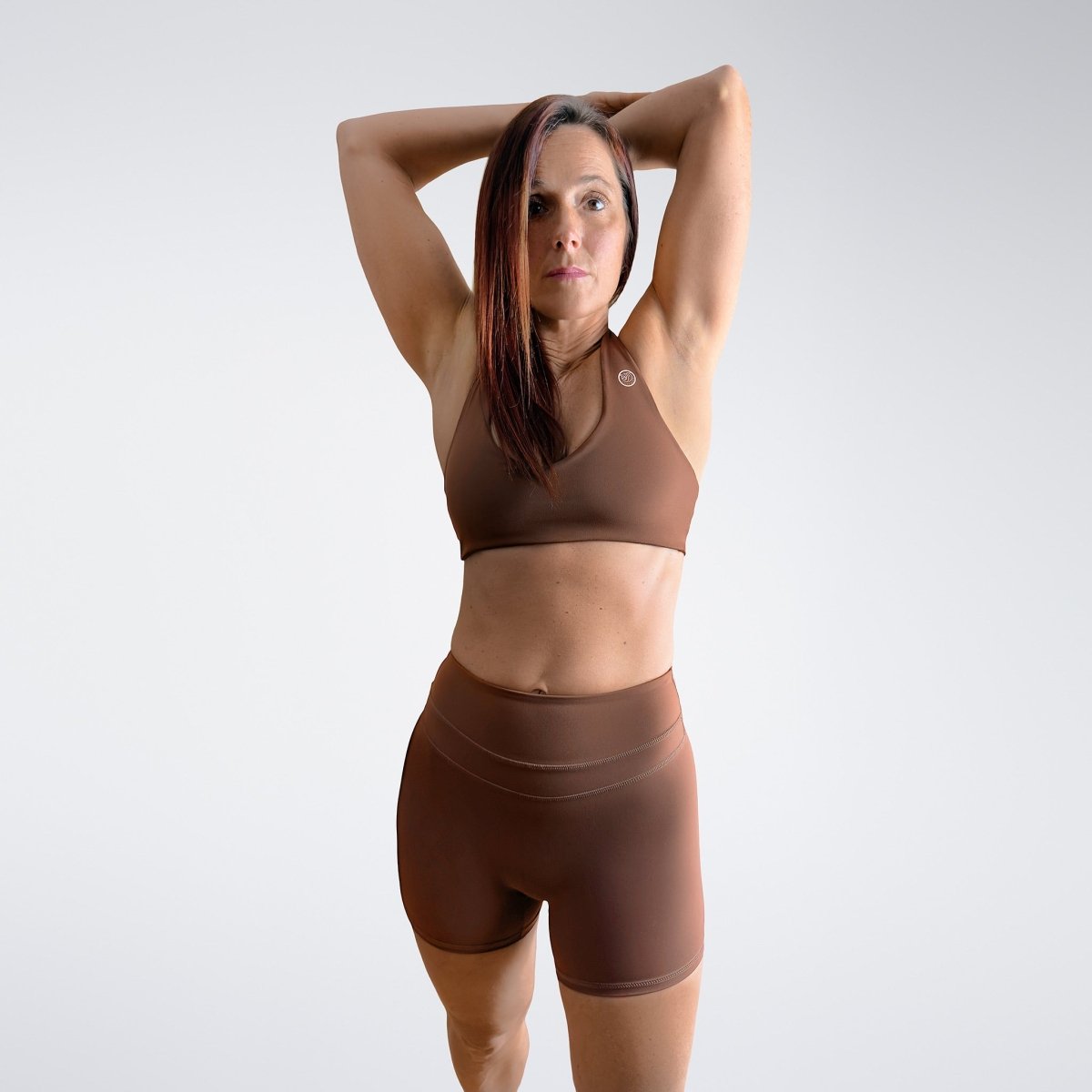 Shorts in chocolate brown on model - Halo Collection activewear