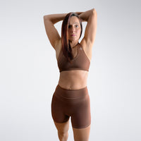 Shorts in chocolate brown on model - Halo Collection activewear