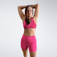 Shorts in hot pink on model - Halo Collection activewear