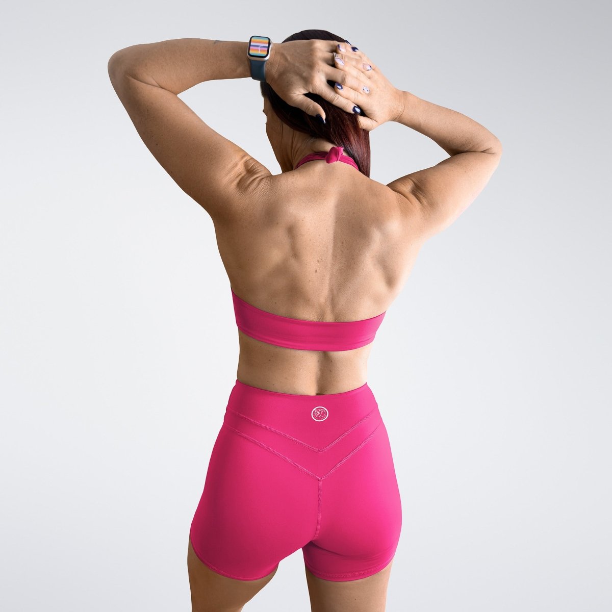 Shorts in hot pink on model - Halo Collection activewear