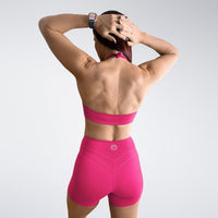 Shorts in hot pink on model - Halo Collection activewear