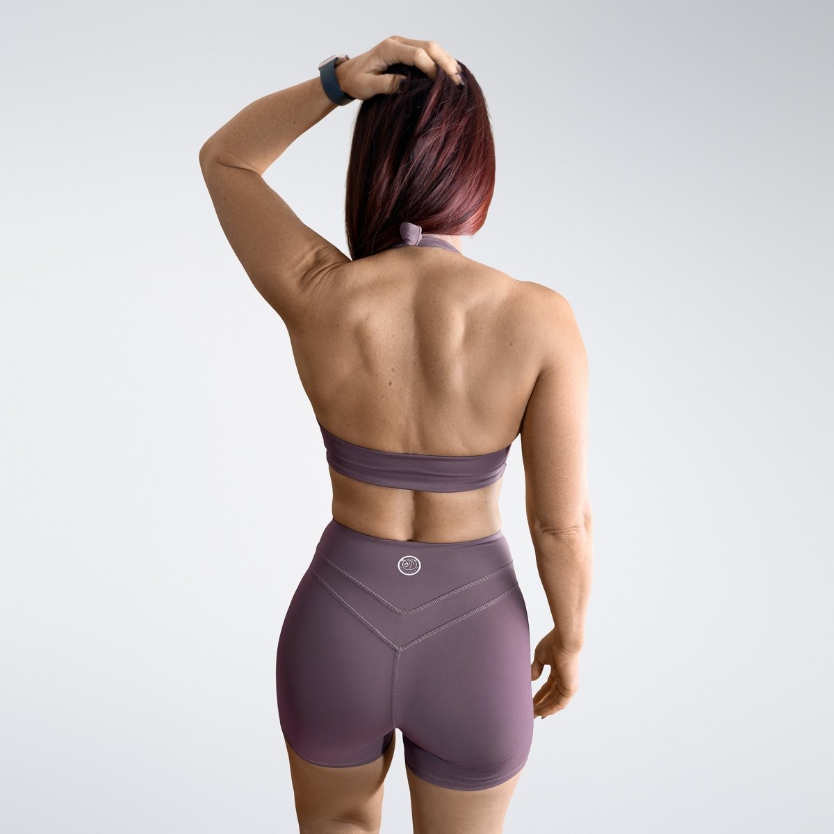 Shorts in plum on model - Halo Collection activewear
