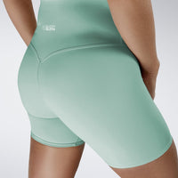 Shorts in mint green on model - Surge Collection activewear