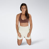 Shorts in ivory cream on model - Surge Collection activewear